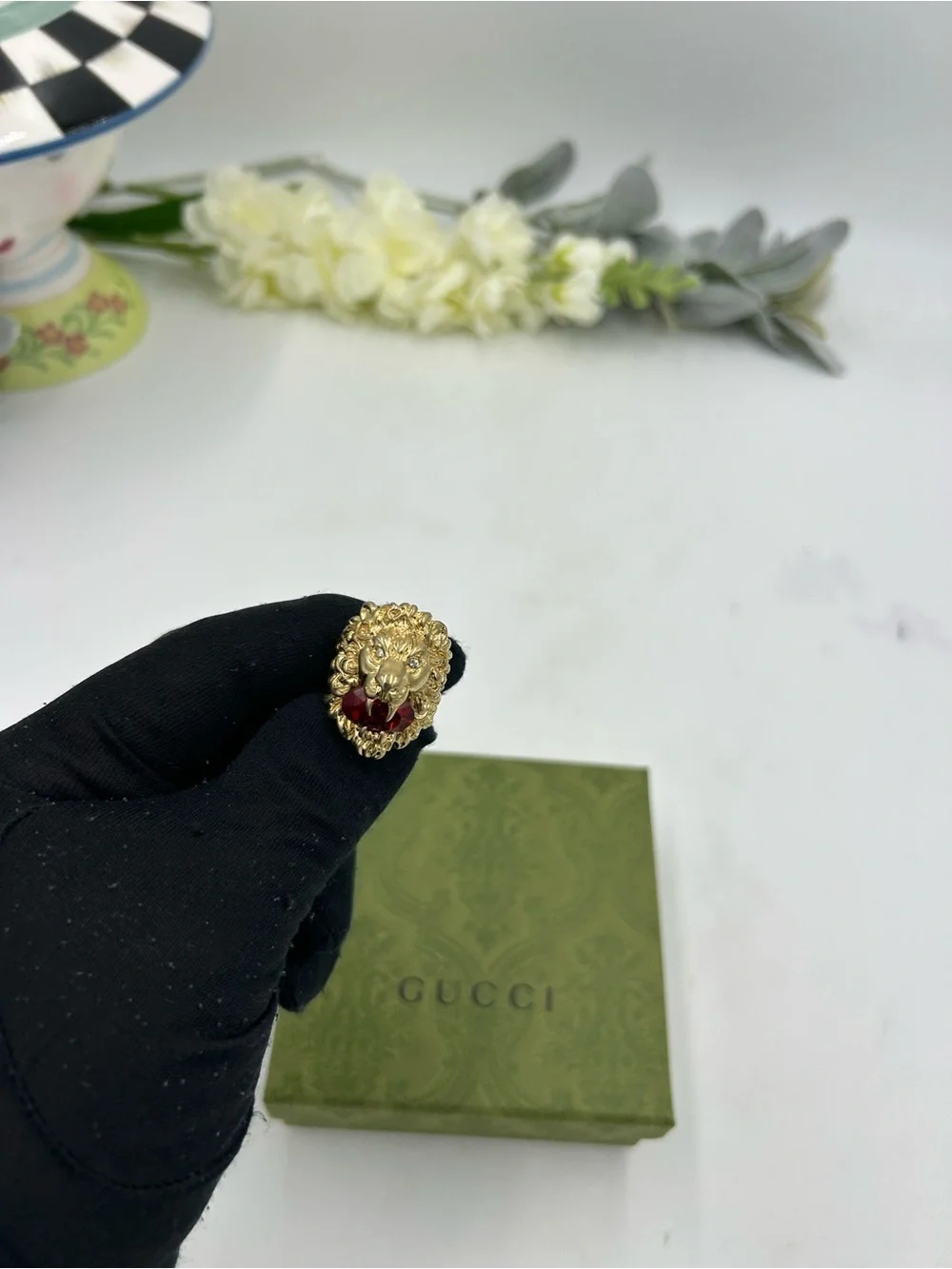Unisex Gucci, Lionhead motif  gold tone with red crystal size 8.5 made in Italy